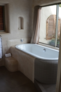 The bathroom features a soaking tub only.
